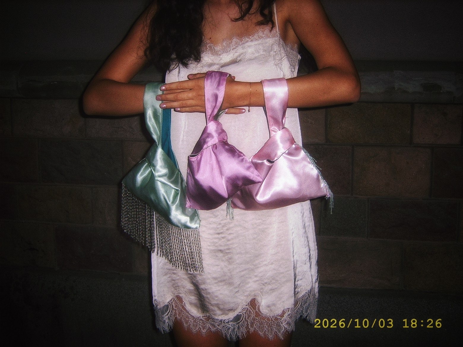 PALOMA satin bags photographed at night